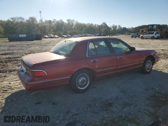 ✅ 1997 Mercury Grand Marquis GS • VIN: 2MELM74W9VX696356 • Лот: 74233334. Опубликован ранее на Copart с пробегом 126 916 миль. Бесплатный доступ к архиву аукционных продаж из США и подробный отчёт об истории автомобиля на DreamBid. Изображение 3.
