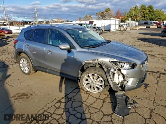 ✅ 2015 Mazda CX-5 Grand Touring • VIN: JM3KE4DY8F0509920 • Lot: 94413445. Listed on Copart with 131,681 mi. Free auction sales archive from the USA and detailed vehicle history report at DreamBid. Image 4.