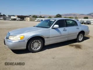 ✅ 1999 Lincoln Town Car Signature • VIN: 1LNHM82W2XY677033 • Lot: 68312345. Listed on Copart with 152,706 mi. Free auction sales archive from the USA and detailed vehicle history report at DreamBid. Image 1.