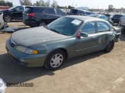 ✅ 1998 Mazda 626 DX • VIN: 1YVGF22C2W5691764 • Lot: 43677590. Wystawiony na IAAI z przebiegiem 142 191 mil. Bezpłatny archiwum sprzedaży aukcyjnych z USA i szczegółowy raport historii pojazdu na DreamBid. Zdjęcie 2.