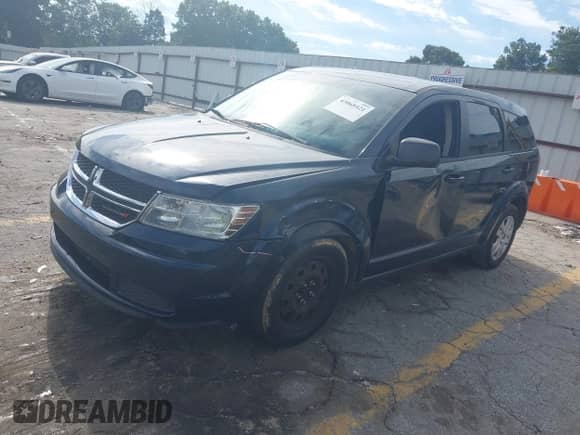 2015 Dodge Journey American Value z VIN 3C4PDCABXFT610861, wystawiony jako IAAI lot #43068421 z przebiegiem 153 937 mil mil oraz . Historia ofert i sprzedaży dostępna na DreamBid. Obrazek 2.