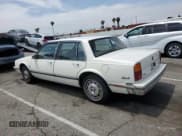 ✅ 1986 Oldsmobile Delta • VIN: 1G3HY6933G1811551 • Лот: 57233005. Опубликован ранее на Copart с пробегом 42 920 миль. Бесплатный доступ к архиву аукционных продаж из США и подробный отчёт об истории автомобиля на DreamBid. Изображение 2.