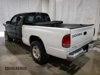 1997 Dodge Dakota z VIN 1B7GG23X0VS253118, wystawiony jako Copart lot #74597754 z przebiegiem 157 636 mil mil oraz Szkoda całkowita • Salvage title. Historia ofert i sprzedaży dostępna na DreamBid. Obrazek 2.