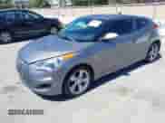 2012 Hyundai Veloster w/Gray Int with VIN KMHTC6AD1CU020968, listed as a IAAI auction lot 43022090 with 165,974 mi miles and . Bid and sale history available at DreamBid. Image 2.