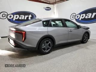 ✅ 2025 Kia K4 LXS • VIN: 3KPFT4DE0SE078481 • Лот: 93752545. Опубликован ранее на Copart с пробегом 23 618 миль. Бесплатный доступ к архиву аукционных продаж из США и подробный отчёт об истории автомобиля на DreamBid. Изображение 3.