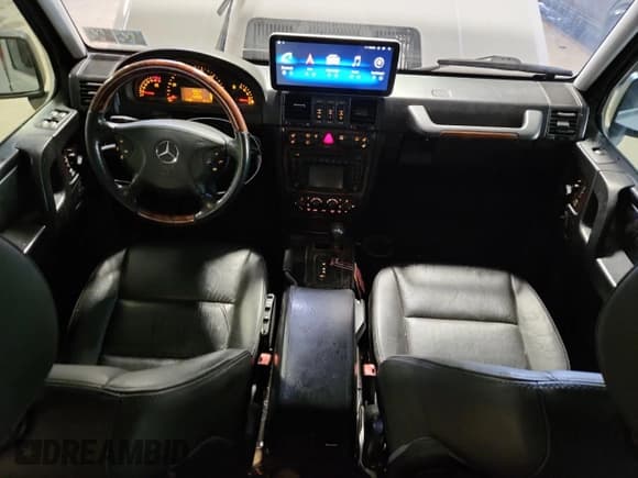 ✅ 2003 Mercedes-Benz G 500 • VIN: WDCYR49E13X142636 • Lot: 63864025. Wystawiony na Copart z przebiegiem 147 520 mil. Bezpłatny archiwum sprzedaży aukcyjnych z USA i szczegółowy raport historii pojazdu na DreamBid. Zdjęcie 8.