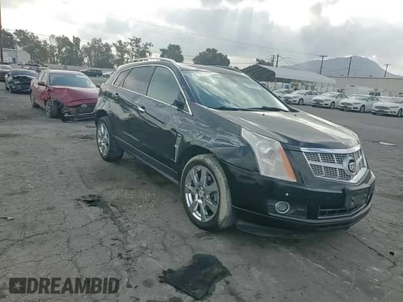 ✅ 2012 Cadillac SRX Performance Collection • VIN: 3GYFNBE31CS577198 • Lot: 81932555. Listed on Copart with 194,810 mi. Free auction sales archive from the USA and detailed vehicle history report at DreamBid. Image 15.
