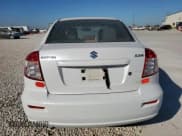 ✅ 2012 Suzuki SX4 LE • VIN: JS2YC5A37C6303297 • Lot: 91703025. Wystawiony na Copart z przebiegiem 113 870 mil. Bezpłatny archiwum sprzedaży aukcyjnych z USA i szczegółowy raport historii pojazdu na DreamBid. Zdjęcie 6.