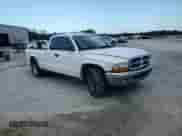 2002 Dodge Dakota SLT с VIN 1B7GL42N72S593692, выставлен на аукционе Copart как лот 69221245 с пробегом 141 599 миль миль и Списание • Salvage title. История ставок и продаж доступна на DreamBid. Изображение 13.