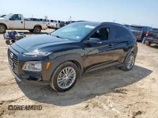 ✅ 2019 Hyundai Kona SEL • VIN: KM8K22AA1KU229400 • Лот: 67353335. Опубликован ранее на Copart с пробегом 77 271 миль. Бесплатный доступ к архиву аукционных продаж из США и подробный отчёт об истории автомобиля на DreamBid. Изображение 1.