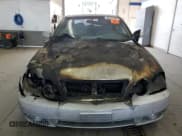 ✅ 2003 Kia Optima LX • VIN: KNAGD126335211255 • Лот: 60637665. Опубликован ранее на Copart с пробегом Не указан. Бесплатный доступ к архиву аукционных продаж из США и подробный отчёт об истории автомобиля на DreamBid. Изображение 5.