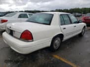 ✅ 1999 Ford Crown Victoria • VIN: 2FAFP73W8XX150079 • Lot: 78923624. Listed on Copart with 128,510 mi. Free auction sales archive from the USA and detailed vehicle history report at DreamBid. Image 3.