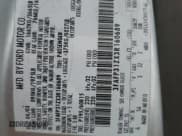 ✅ 2003 Ford Focus ZX3 • VIN: 3FAFP31ZX3R160689 • Lot: 80323535. Listed on Copart with 272,787 mi. Free auction sales archive from the USA and detailed vehicle history report at DreamBid. Image 12.