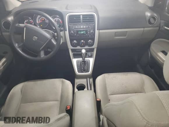 2010 Dodge Caliber Mainstreet с VIN 1B3CB3HA0AD639111, выставлен на аукционе Copart как лот 60662114 с пробегом 102 935 миль миль и Списание • Salvage title. История ставок и продаж доступна на DreamBid. Изображение 8.