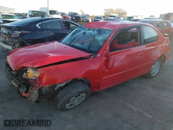 2005 Hyundai Accent GLS with VIN KMHCG35C65U348300, listed as a Copart auction lot 77847614 with 141,102 mi miles and Salvage title. Bid and sale history available at DreamBid. Image 1.
