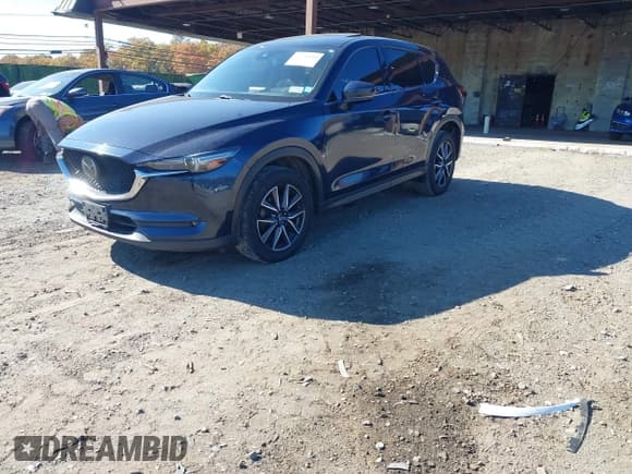 ✅ 2018 Mazda CX-5 Grand Touring • VIN: JM3KFBDM6J0473734 • Лот: 43536049. Опубликован ранее на IAAI с пробегом 124 488 миль. Бесплатный доступ к архиву аукционных продаж из США и подробный отчёт об истории автомобиля на DreamBid. Изображение 17.