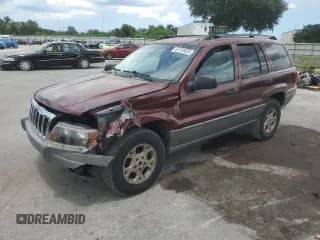✅ 2002 Jeep Grand Cherokee Laredo • VIN: 1J4GX48SX2C141273 • Lot: 80718395. Listed on Copart with 137,248 mi. Free auction sales archive from the USA and detailed vehicle history report at DreamBid. Image 1.