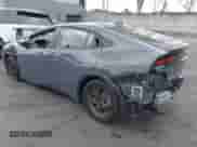 2024 Toyota Prius LE with VIN JTDACAAU6R3046057, listed as a IAAI auction lot 43316816 with 14,220 mi miles and . Bid and sale history available at DreamBid. Image 3.