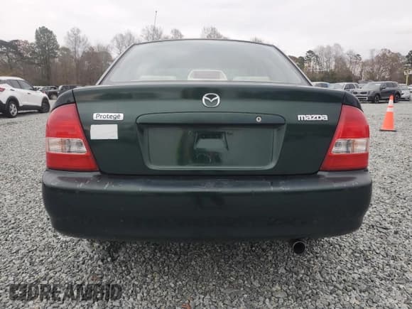 ✅ 2001 Mazda Protege DX • VIN: JM1BJ222010447414 • Лот: 81344584. Опубликован ранее на Copart с пробегом 195 931 миль. Бесплатный доступ к архиву аукционных продаж из США и подробный отчёт об истории автомобиля на DreamBid. Изображение 6.