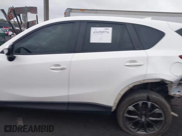 ✅ 2016 Mazda CX-5 Grand Touring • VIN: JM3KE4DY5G0760878 • Lot: 43450576. Wystawiony na IAAI z przebiegiem 143 780 mil. Bezpłatny archiwum sprzedaży aukcyjnych z USA i szczegółowy raport historii pojazdu na DreamBid. Zdjęcie 14.