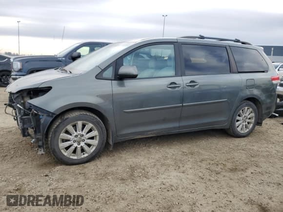✅ 2012 Toyota Sienna LE • VIN: 5TDJK3DC7CS039741 • Lot: 91675575. Listed on Copart with 215,437 mi. Free auction sales archive from the USA and detailed vehicle history report at DreamBid. Image 1.