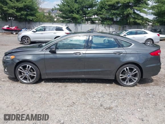 ✅ 2020 Ford Fusion Titanium • VIN: 3FA6P0D97LR116854 • Lot: 43081513. Listed on IAAI with 97,625 mi. Free auction sales archive from the USA and detailed vehicle history report at DreamBid. Image 14.
