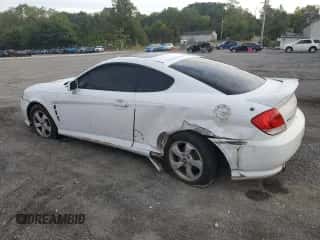 ✅ 2005 Hyundai Tiburon GS • VIN: KMHHM65D35U184724 • Лот: 84444495. Опубликован ранее на Copart с пробегом 203 238 миль. Бесплатный доступ к архиву аукционных продаж из США и подробный отчёт об истории автомобиля на DreamBid. Изображение 2.