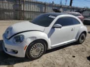 ✅ 2015 Volkswagen Beetle 1.8T • VIN: 3VWJ17AT4FM637303 • Lot: 90441345. Listed on Copart with 103,844 mi. Free auction sales archive from the USA and detailed vehicle history report at DreamBid. Image 1.