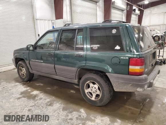 ✅ 1996 Jeep Grand Cherokee Laredo • VIN: 1J4GZ58S9TC198257 • Lot: 93327175. Listed on Copart with 169,183 mi. Free auction sales archive from the USA and detailed vehicle history report at DreamBid. Image 2.