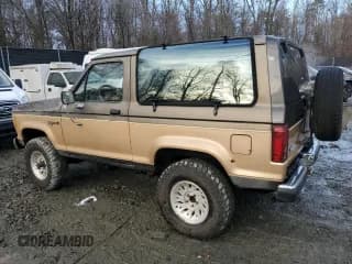 ✅ 1988 Ford Bronco • VIN: 1FMCU14T6JUA71950 • Лот: 85363734. Опубликован ранее на Copart с пробегом 47 657 миль. Бесплатный доступ к архиву аукционных продаж из США и подробный отчёт об истории автомобиля на DreamBid. Изображение 2.