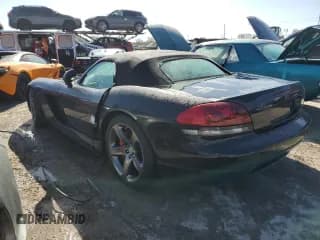 ✅ 2004 Dodge Viper SRT-10 • VIN: 1B3JZ65ZX4V102291 • Lot: 75934444. Listed on Copart with 31,910 mi. Free auction sales archive from the USA and detailed vehicle history report at DreamBid. Image 2.