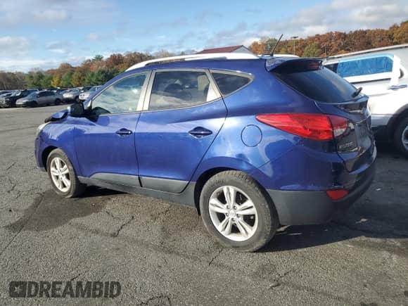 2013 Hyundai Tucson GLS z VIN KM8JUCAC7DU621295, wystawiony jako Copart lot #89889485 z przebiegiem 56 897 mil mil oraz Szkoda całkowita • Salvage title. Historia ofert i sprzedaży dostępna na DreamBid. Obrazek 2.