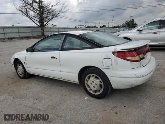 ✅ 1997 Saturn SC • VIN: 1G8ZF1282VZ133256 • Лот: 74026354. Опубликован ранее на Copart с пробегом 84 564 миль. Бесплатный доступ к архиву аукционных продаж из США и подробный отчёт об истории автомобиля на DreamBid. Изображение 2.