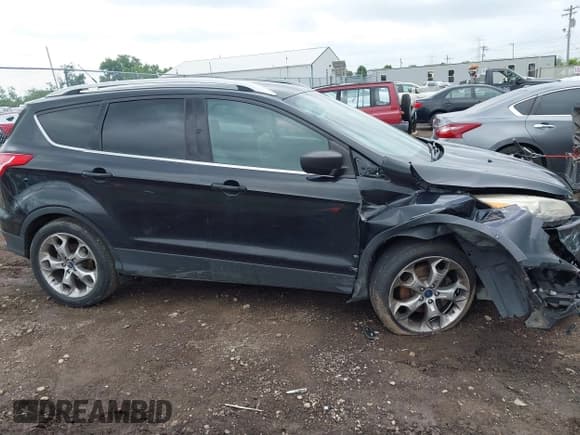 ✅ 2015 Ford Escape Titanium • VIN: 1FMCU9J94FUC39311 • Lot: 42542693. Listed on IAAI with 129,747 mi. Free auction sales archive from the USA and detailed vehicle history report at DreamBid. Image 13.