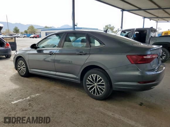 ✅ 2021 Volkswagen Jetta S • VIN: 3VWC57BU5MM038623 • Lot: 90938325. Listed on Copart with 81,241 mi. Free auction sales archive from the USA and detailed vehicle history report at DreamBid. Image 2.
