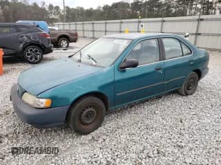 ✅ 1997 Nissan Sentra XE • VIN: 1N4AB41D5VC701930 • Lot: 47263305. Wystawiony na Copart z przebiegiem 156 982 mil. Bezpłatny archiwum sprzedaży aukcyjnych z USA i szczegółowy raport historii pojazdu na DreamBid. Zdjęcie 1.