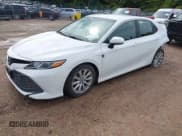 ✅ 2018 Toyota Camry LE • VIN: 4T1B11HK9JU077165 • Lot: 43270439. Listed on IAAI with 184,090 mi. Free auction sales archive from the USA and detailed vehicle history report at DreamBid. Image 2.