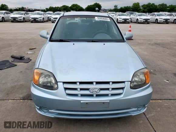 2003 Hyundai Accent GL z VIN KMHCG45C73U481294, wystawiony jako Copart lot #55958005 z przebiegiem 136 964 mil mil oraz Czysty tytuł • Clean title. Historia ofert i sprzedaży dostępna na DreamBid. Obrazek 5.