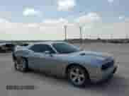 2014 Dodge Challenger SXT z VIN 2C3CDYAG7EH231853, wystawiony jako Copart lot #57032924 z przebiegiem 160 093 mil mil oraz Szkoda całkowita • Salvage title. Historia ofert i sprzedaży dostępna na DreamBid. Obrazek 4.