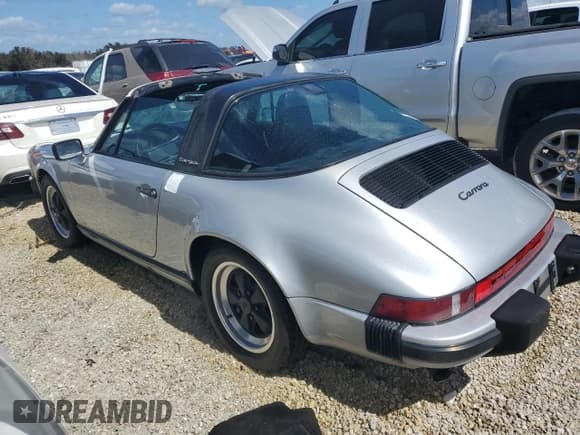 ✅ 1986 Porsche 911 • VIN: WP0EB0917GS161455 • Lot: 74672764. Wystawiony na Copart z przebiegiem 80 076 mil. Bezpłatny archiwum sprzedaży aukcyjnych z USA i szczegółowy raport historii pojazdu na DreamBid. Zdjęcie 2.