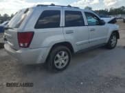 ✅ 2010 Jeep Grand Cherokee Laredo • VIN: 1J4PS4GK1AC103462 • Lot: 84594905. Listed on Copart with 198,900 mi. Free auction sales archive from the USA and detailed vehicle history report at DreamBid. Image 3.