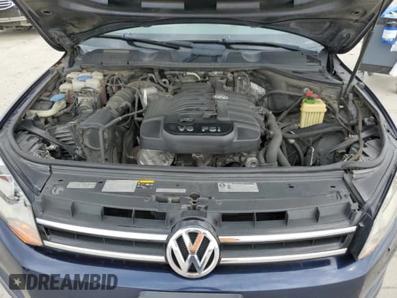 ✅ 2013 Volkswagen Touareg Exec • VIN: WVGEF9BP6DD013915 • Lot: 55024485. Listed on Copart with 238,848 mi. Free auction sales archive from the USA and detailed vehicle history report at DreamBid. Image 12.