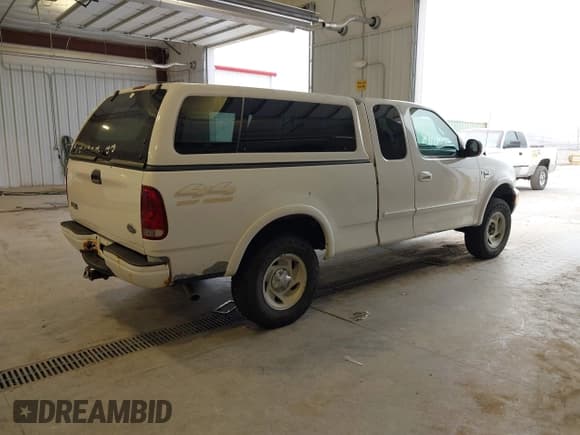 ✅ 2000 Ford F-150 XL • VIN: 1FTRX18LXYKA98588 • Lot: 43153725. Listed on IAAI with 215,950 mi. Free auction sales archive from the USA and detailed vehicle history report at DreamBid. Image 4.