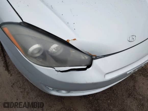 2008 Hyundai Tiburon GS z VIN KMHHM66D08U268552, wystawiony jako IAAI lot #41729193 z przebiegiem 88 939 mil mil oraz . Historia ofert i sprzedaży dostępna na DreamBid. Obrazek 14.