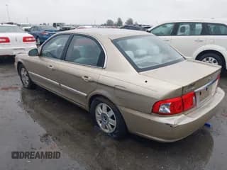 ✅ 2003 Kia Optima LX • VIN: KNAGD128X35244612 • Lot: 43759125. Wystawiony na IAAI z przebiegiem 104 682 mil. Bezpłatny archiwum sprzedaży aukcyjnych z USA i szczegółowy raport historii pojazdu na DreamBid. Zdjęcie 3.
