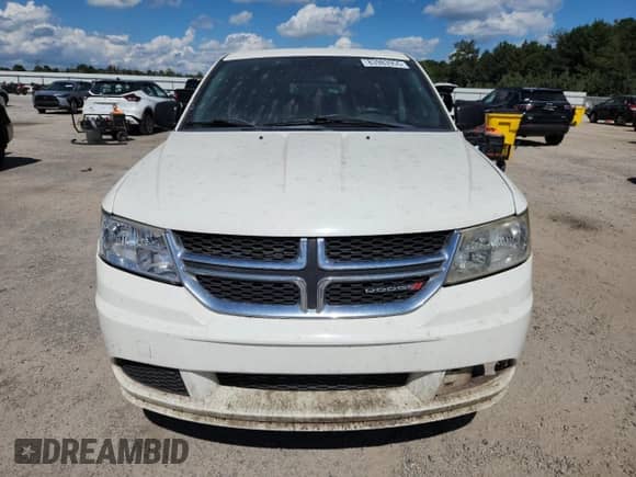 2012 Dodge Journey American Value z VIN 3C4PDCAB9CT353221, wystawiony jako Copart lot #83983955 z przebiegiem 312 681 mil mil oraz Szkoda całkowita • Salvage title. Historia ofert i sprzedaży dostępna na DreamBid. Obrazek 5.
