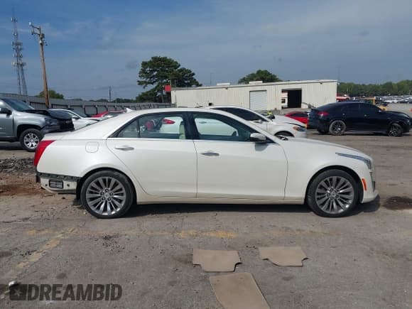 ✅ 2014 Cadillac CTS Luxury AWD • VIN: 1G6AX5S30E0187450 • Lot: 43244469. Listed on IAAI with 103,604 mi. Free auction sales archive from the USA and detailed vehicle history report at DreamBid. Image 13.