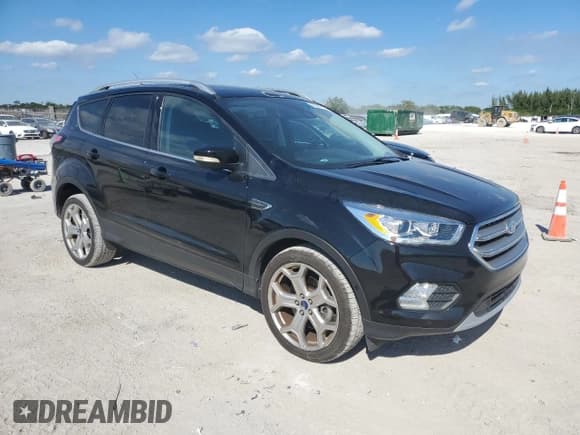 ✅ 2017 Ford Escape Titanium • VIN: 1FMCU9J91HUE85901 • Lot: 93261735. Listed on Copart with Not provided. Free auction sales archive from the USA and detailed vehicle history report at DreamBid. Image 4.