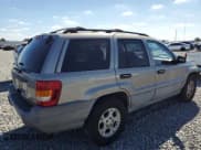 ✅ 1999 Jeep Grand Cherokee Laredo • VIN: 1J4GW58S1XC609388 • Lot: 91454555. Listed on Copart with 147,826 mi. Free auction sales archive from the USA and detailed vehicle history report at DreamBid. Image 3.