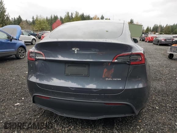 ✅ 2022 Tesla Model Y Long Range • VIN: 7SAYGDEE8NF576652 • Lot: 92876055. Listed on Copart with 22,683 mi. Free auction sales archive from the USA and detailed vehicle history report at DreamBid. Image 6.